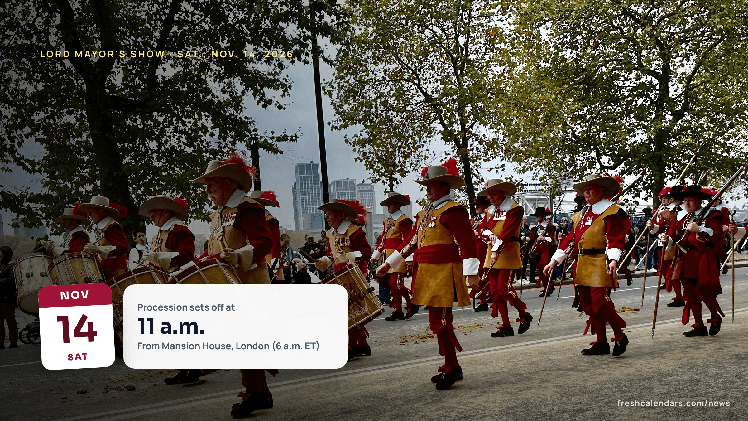 Drummers in red and gold uniforms march in a past Lord Mayor's Show procession in the City of London