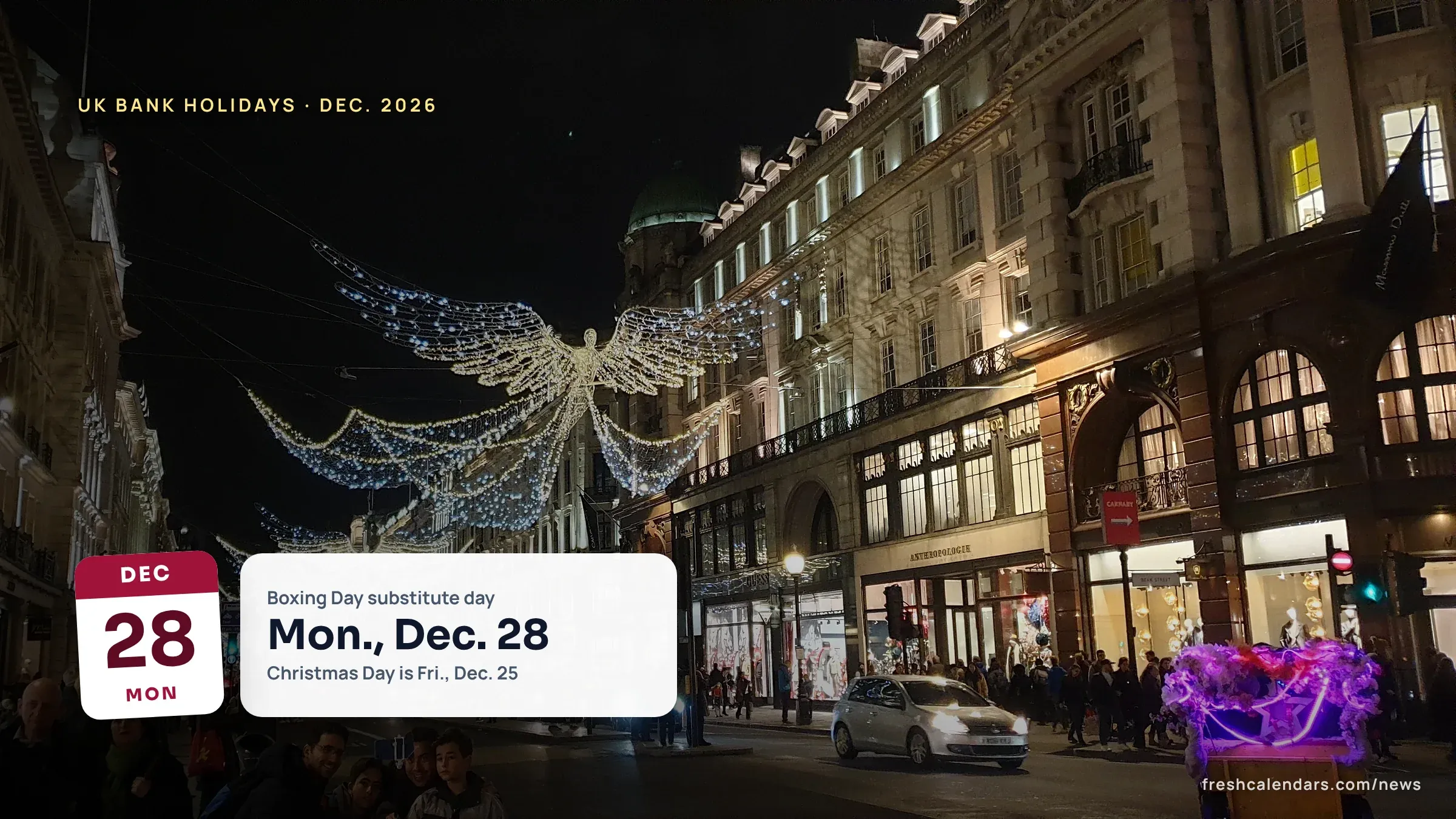 Christmas angel lights hang over Regent Street in London as shoppers fill the pavements