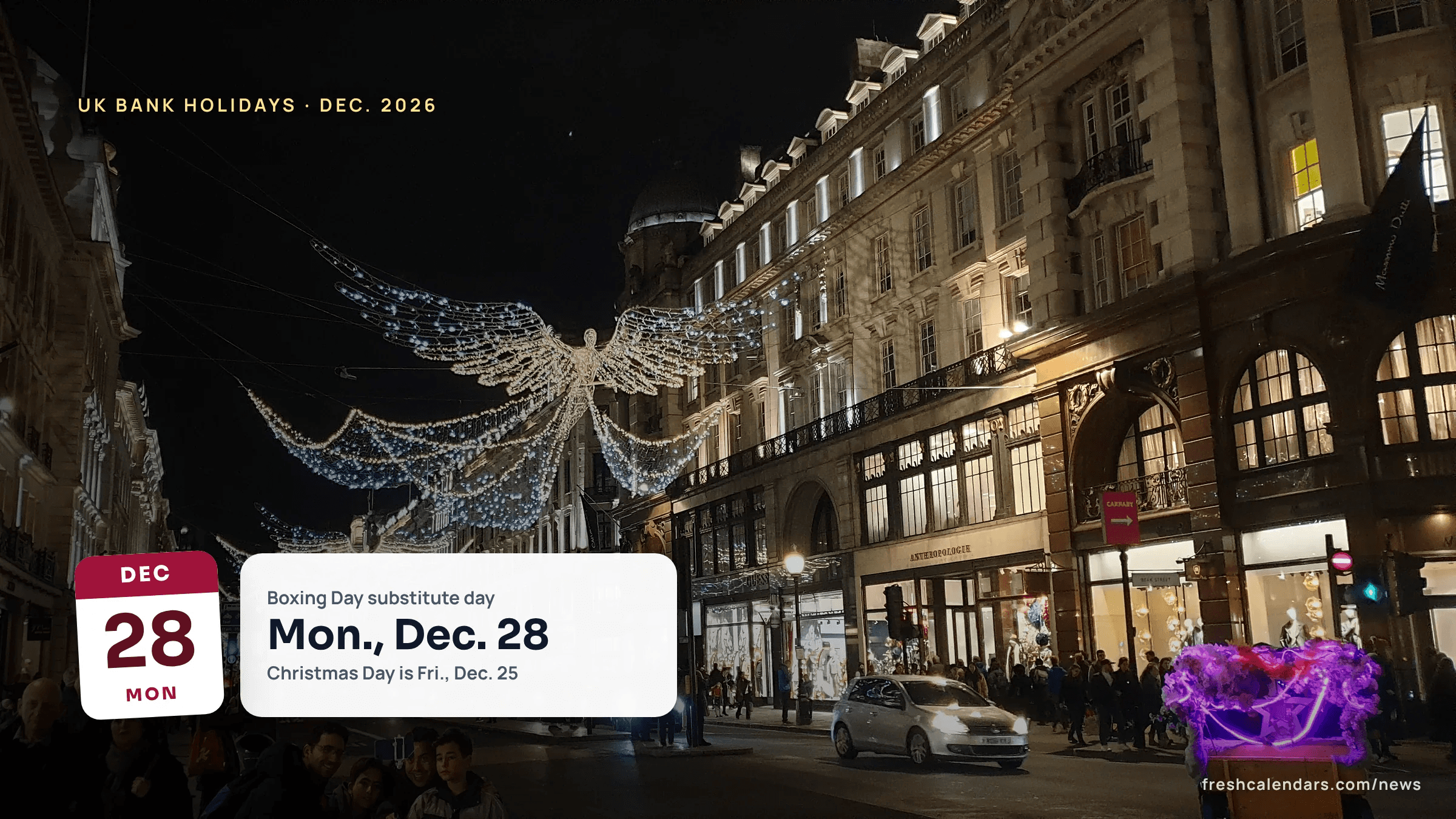 Christmas angel lights hang over Regent Street in London as shoppers fill the pavements