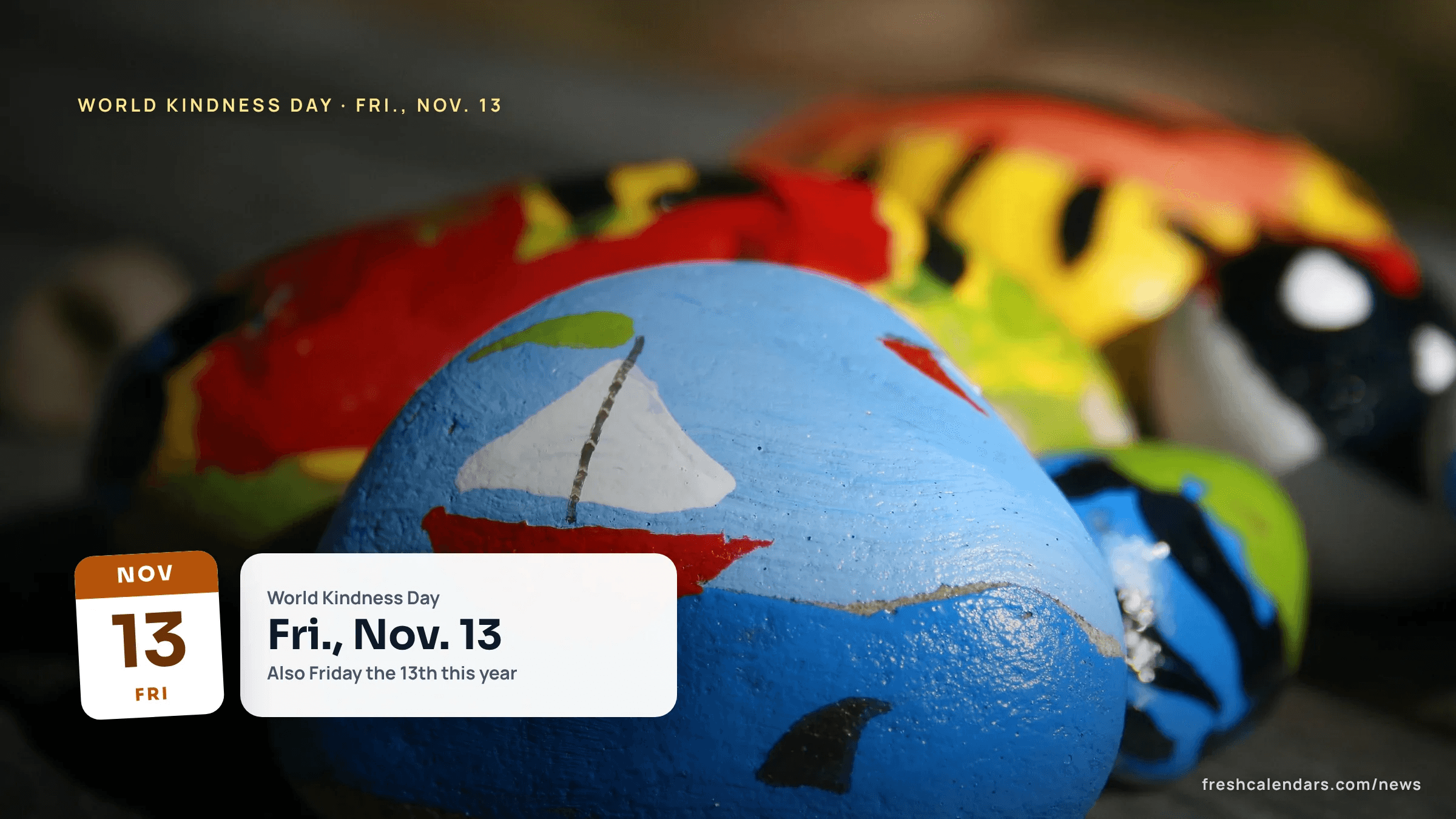 Painted kindness rocks with a sailboat and bright patterns, the kind of small gesture shared on World Kindness Day 2026